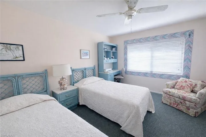 Bedroom featuring ceiling fan and carpet flooring