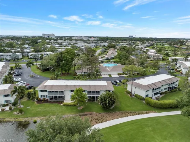 Arial View, condo lower left, with short walk to one of nine pools.