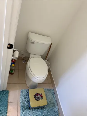 Bathroom with tile patterned floors and toilet