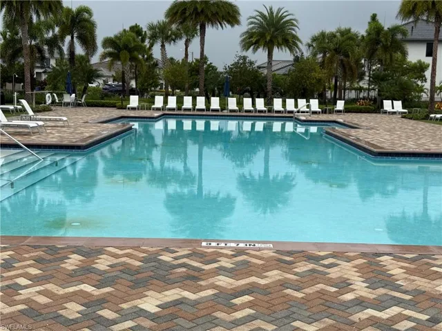 Community pool with a patio area