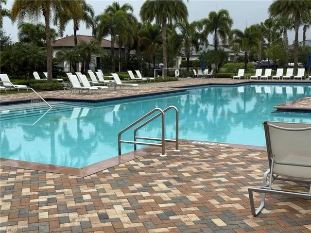 Community pool with a patio area