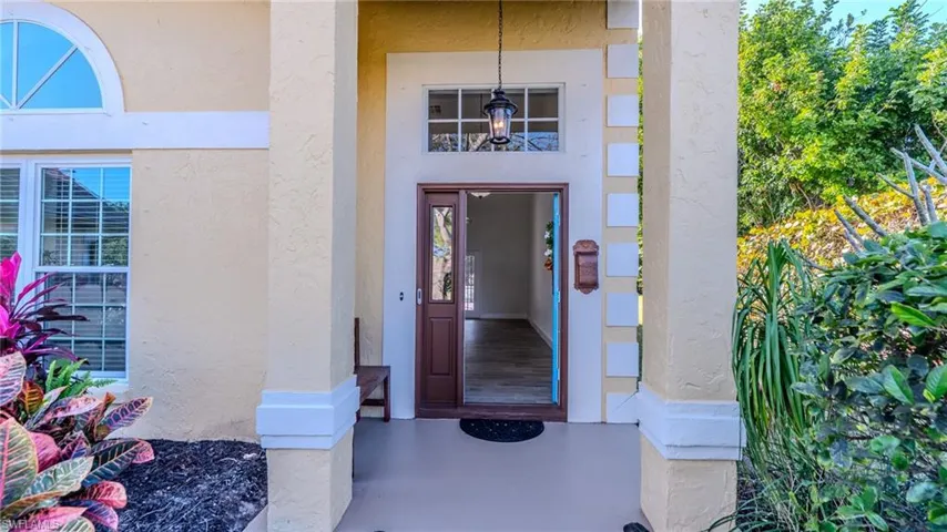 Property entrance with stucco siding