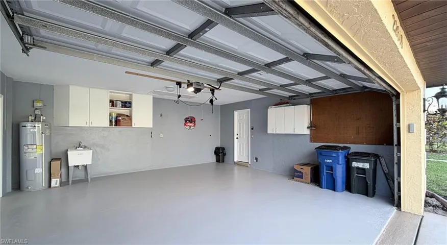 Garage featuring water heater