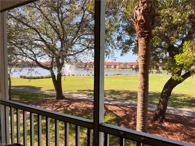 View of yard featuring a water view and fountain