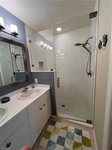 Bathroom with vanity and walk in shower