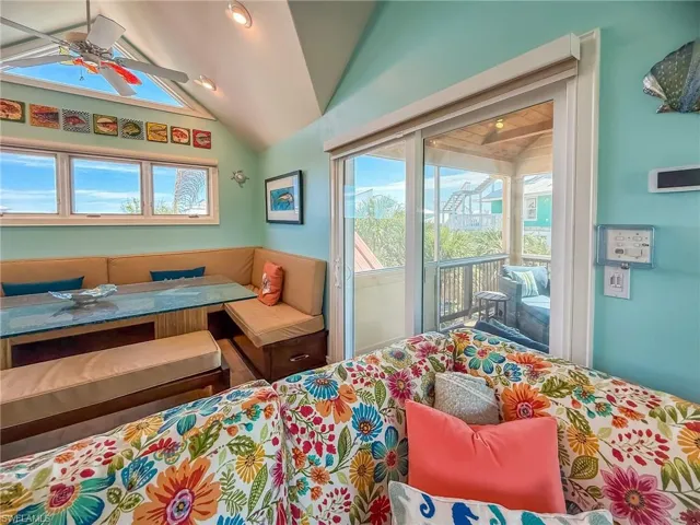 Bedroom with lofted ceiling and access to exterior