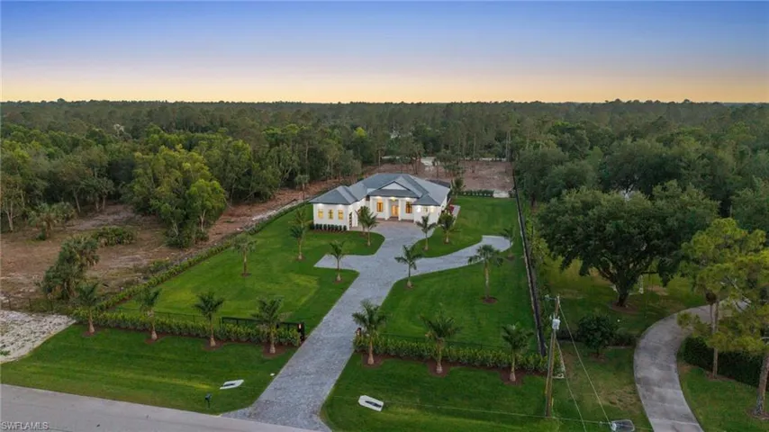 Aerial view featuring a view of trees