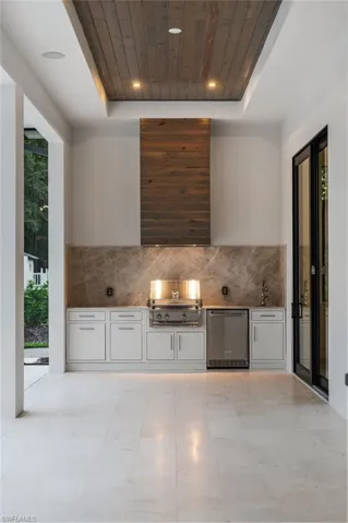 Outdoor Kitchen with Grill, Bev Fridge, sink, hood, T&G, Shellstone Floors