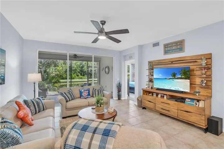 Tiled living room with ceiling fan