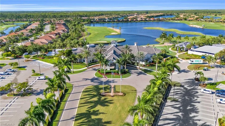 Birds eye view of property with a water view