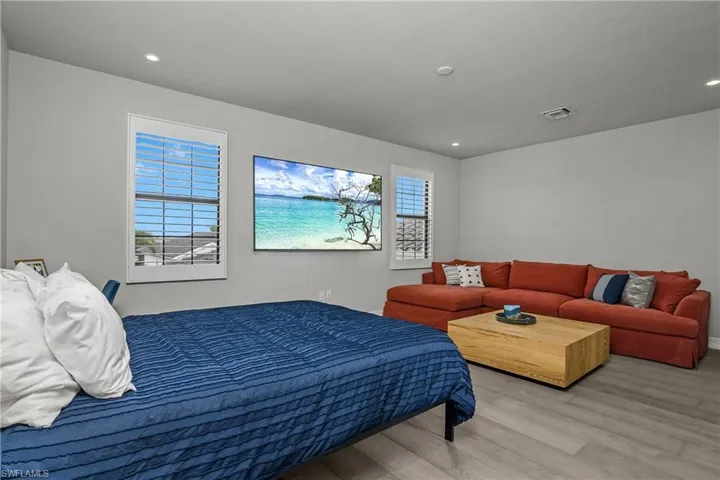 Bedroom featuring wood finished floors and recessed lighting