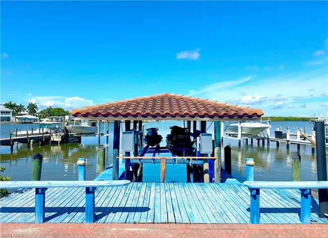 Dock area featuring a water view