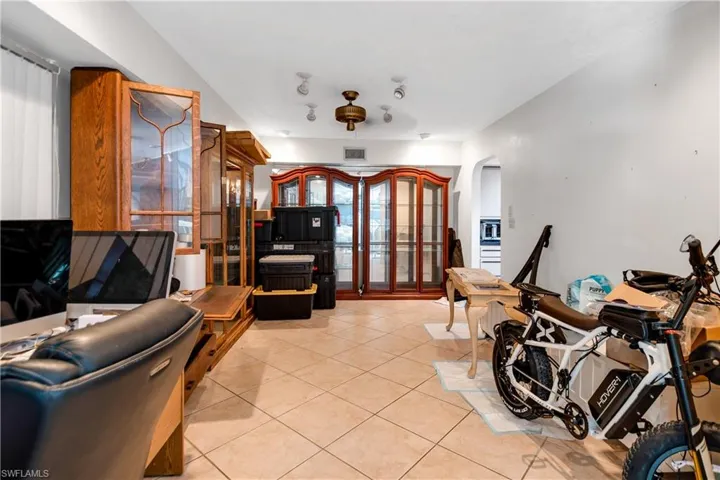 Living room with light tile flooring