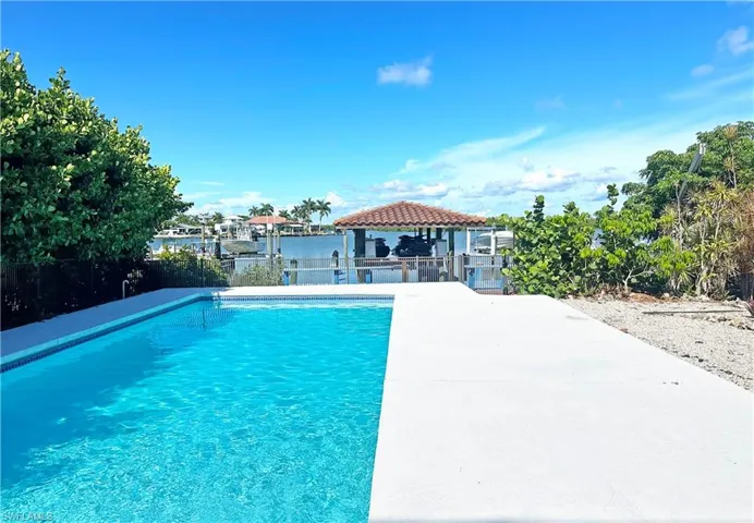 View of swimming pool with a gazebo