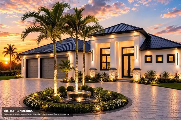 Paver driveway with a central landscaped island featuring an illuminated water feature