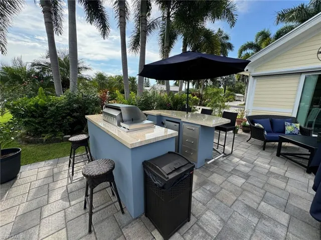View of patio / terrace featuring a grill, outdoor lounge area, and area for grilling
