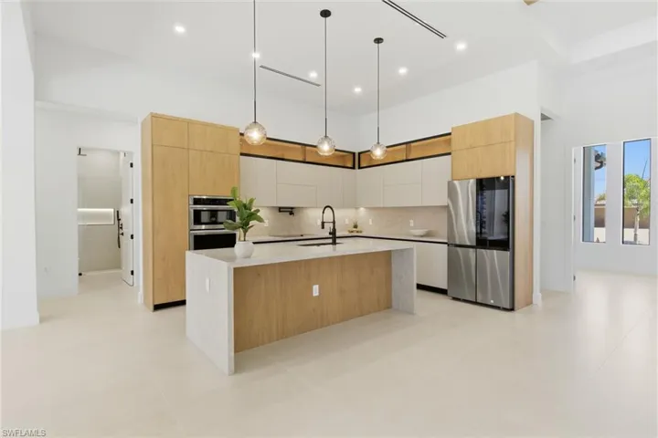 GOURMET KITCHEN is a CULINARIAN’S DREAM, featuring TOP-OF-THE-LINE SAMSUNG APPLIANCES