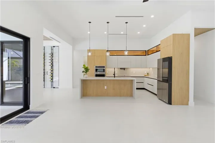 electric WALL OVEN w/ built-in WALL MICROWAVE, INDUCTION COOKTOP w/ black glass, INTEGRATED DISHWASHER