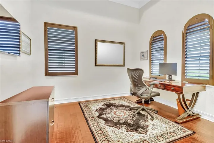 Office featuring hardwood / wood-style floors