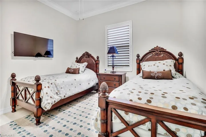 Bedroom featuring crown molding