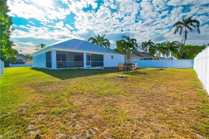 View of yard with a sunroom