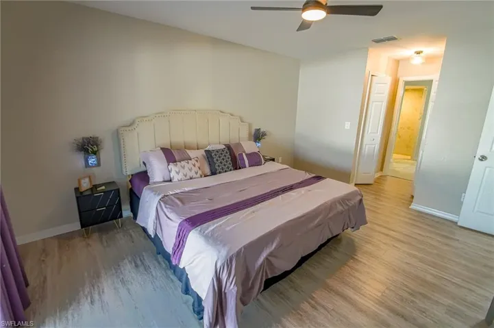 Bedroom featuring hardwood / wood-style flooring and ceiling fan