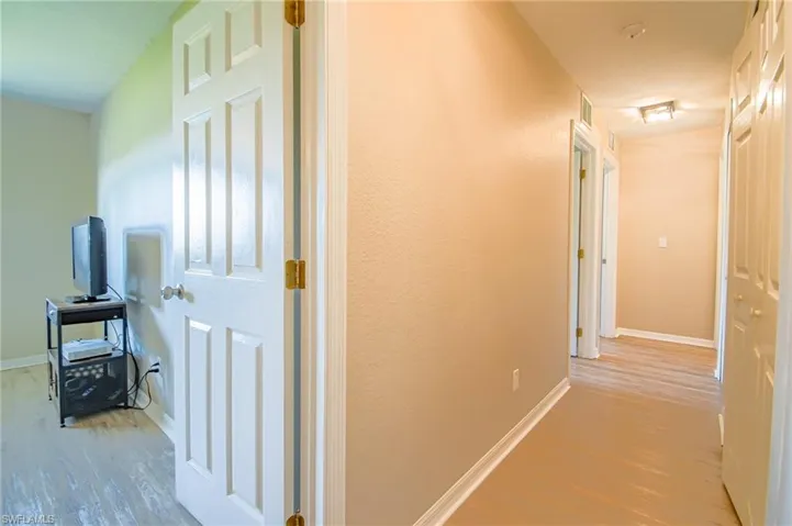 Hall with wood-type flooring