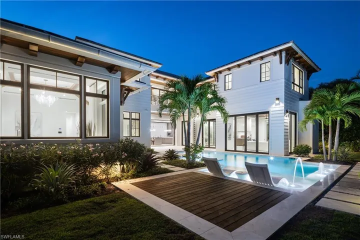 Rear view of house with an outdoor pool