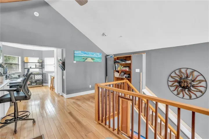 Hall featuring lofted ceiling and light hardwood / wood-style floors