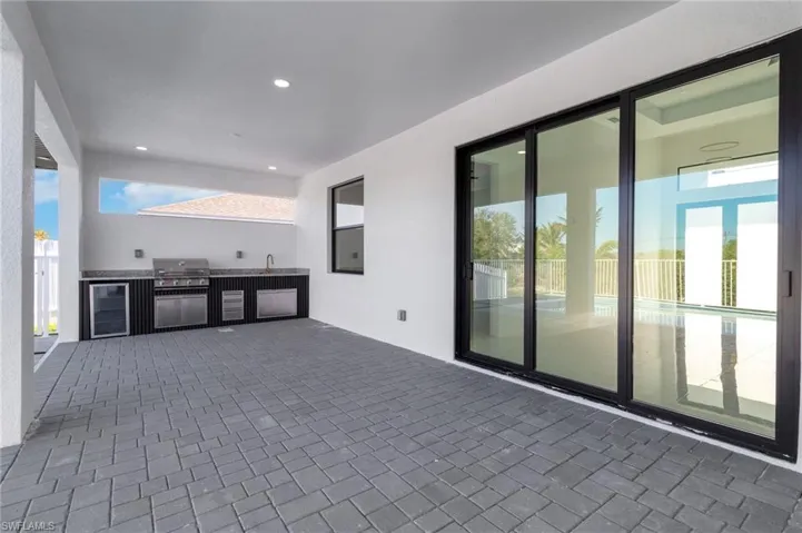 View of patio / terrace featuring area for grilling and wine cooler