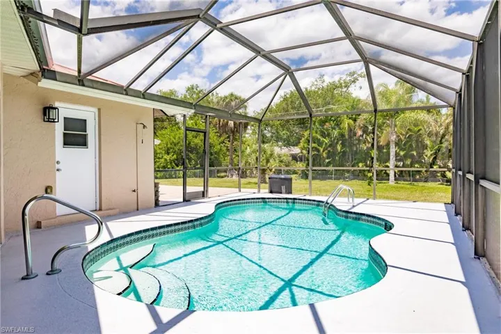 View of pool featuring a lanai and a patio area