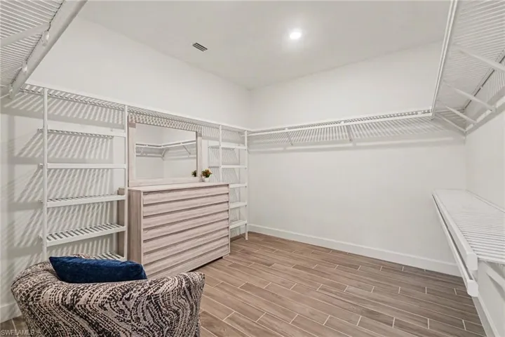 Walk in closet featuring wood tiled floors