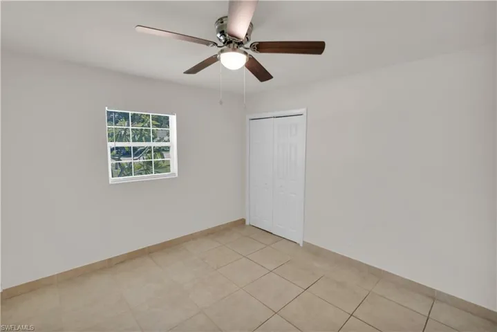 Bedroom #2 Is Tilted And Has New Closet Doors And A New Ceiling Fan/Light!