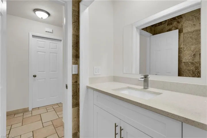 The Spare Bathroom Comes With A New Sink, Countertop, Toilet, Mirror, & Light!