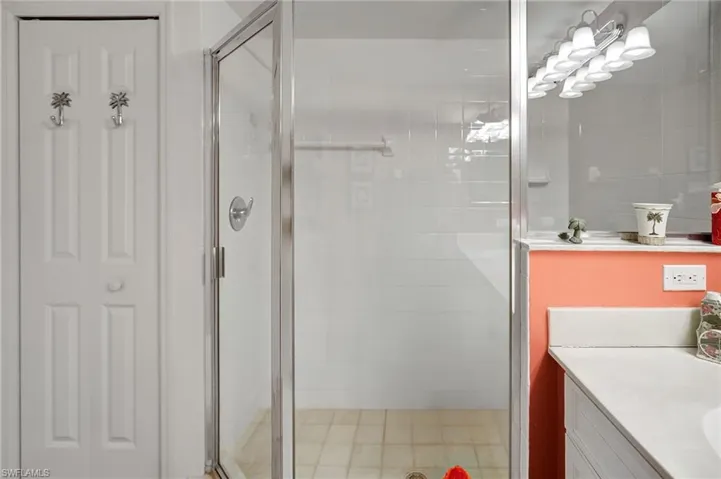 Bathroom with a stall shower and vanity
