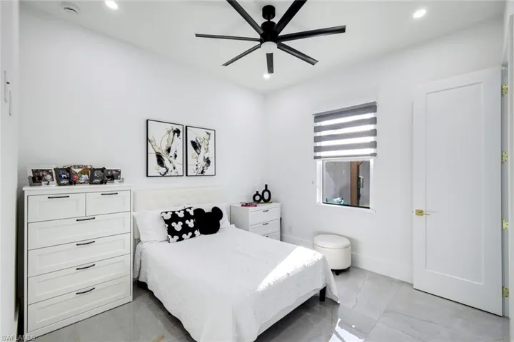 Bedroom with recessed lighting, baseboards, and a ceiling fan