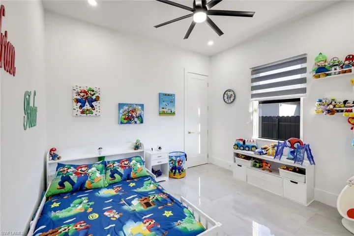 Bedroom featuring recessed lighting, baseboards, and ceiling fan