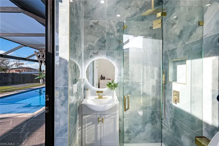 Full bathroom with a stall shower and vanity