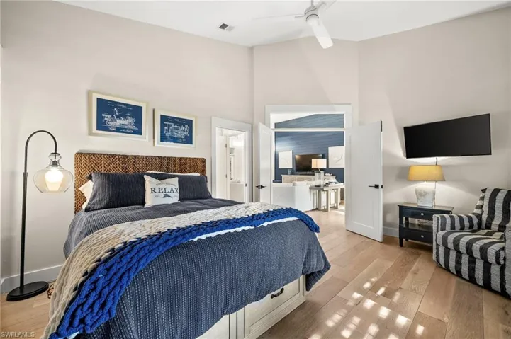Bedroom featuring ceiling fan and light hardwood / wood-style flooring