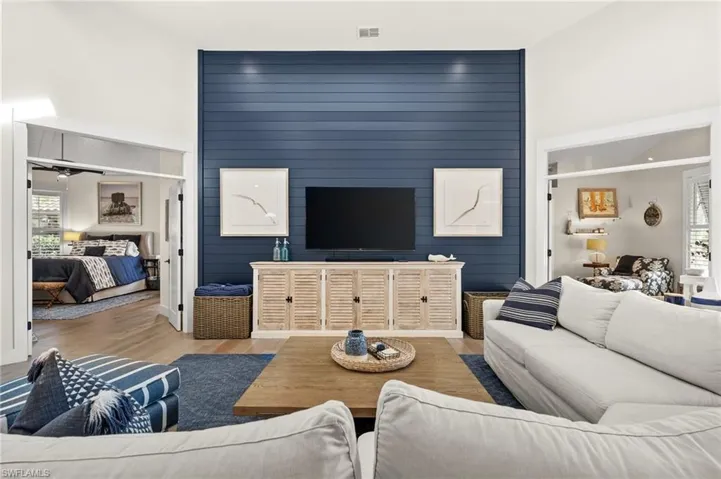 Living room featuring light hardwood / wood-style floors and ceiling fan