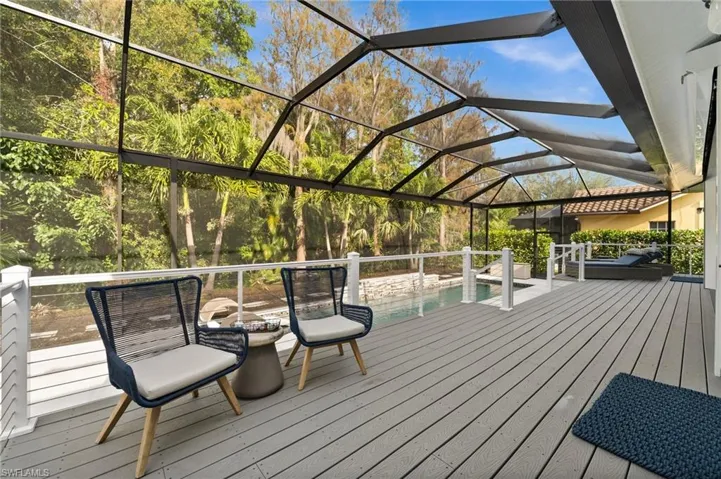 Wooden deck featuring a lanai