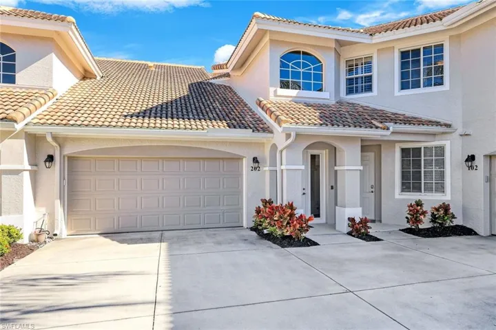 Mediterranean / spanish house with stucco siding, concrete driveway, a garage, and a tile roof