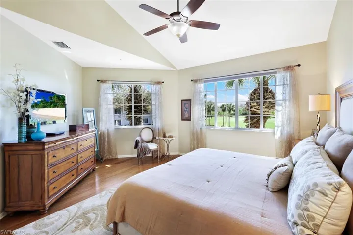 Master Bedroom featuring lofted ceiling, wood finished floors, and ceiling fan