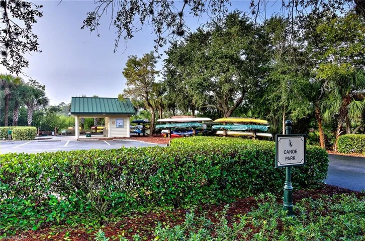 Kayak park View of home's community featuring uncovered parking