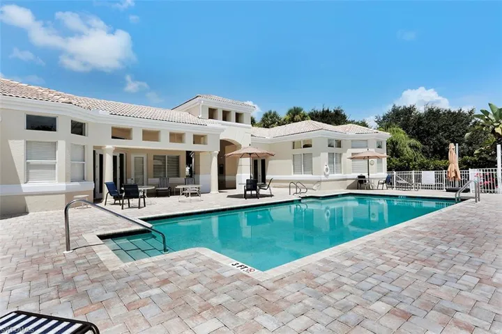 Community pool with a patio area