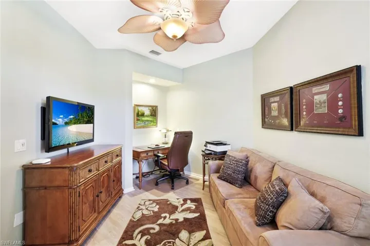 Office space featuring light wood-style floors and a ceiling fan