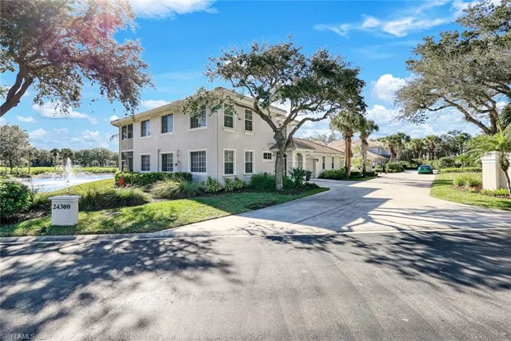 View of front of home featuring driveway and stucco siding
