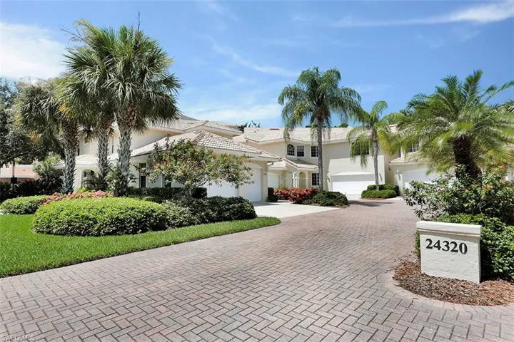 View of front of home featuring decorative driveway, an attached garage, and stucco siding