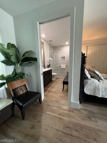 Hall with light wood finished floors