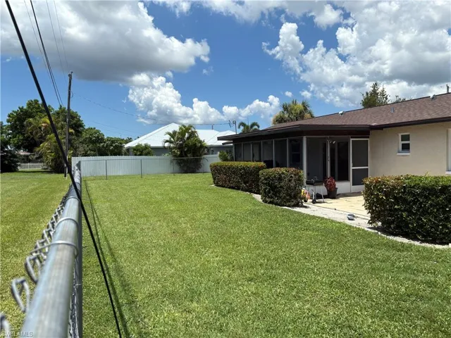 View of yard featuring a sunroom